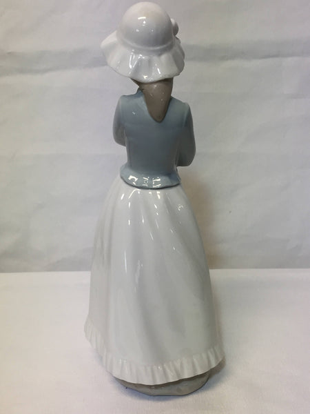 NAO/ LLADRO, porcelain figurine "Girl with a puppy dog." SOLD- SOLD - SOLD