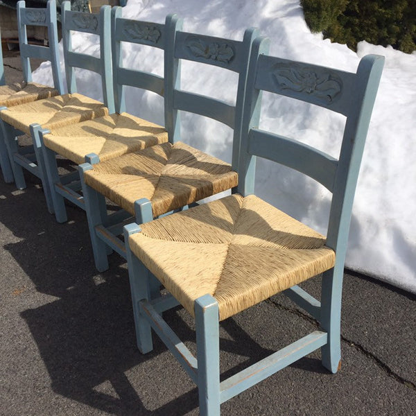 Set of 7 Vintage Folk Art Primitive Mexican Painted Carved Ladder Back Chairs rush seats. Original light blue distressed painted finish.
