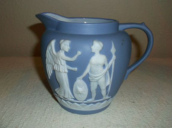 Blue and white pitcher with greek figures