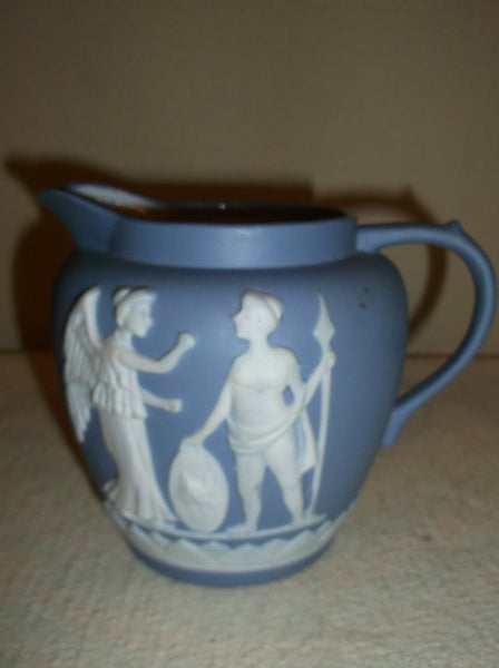 Blue and white pitcher with greek figures