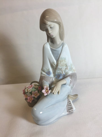 Lladro #7607 Flower Song 1988, girl sitting with flower basket 7" Tall