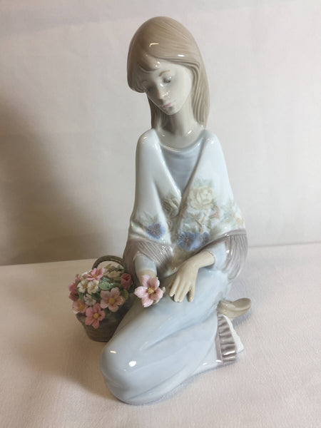 Lladro #7607 Flower Song 1988, girl sitting with flower basket 7" Tall